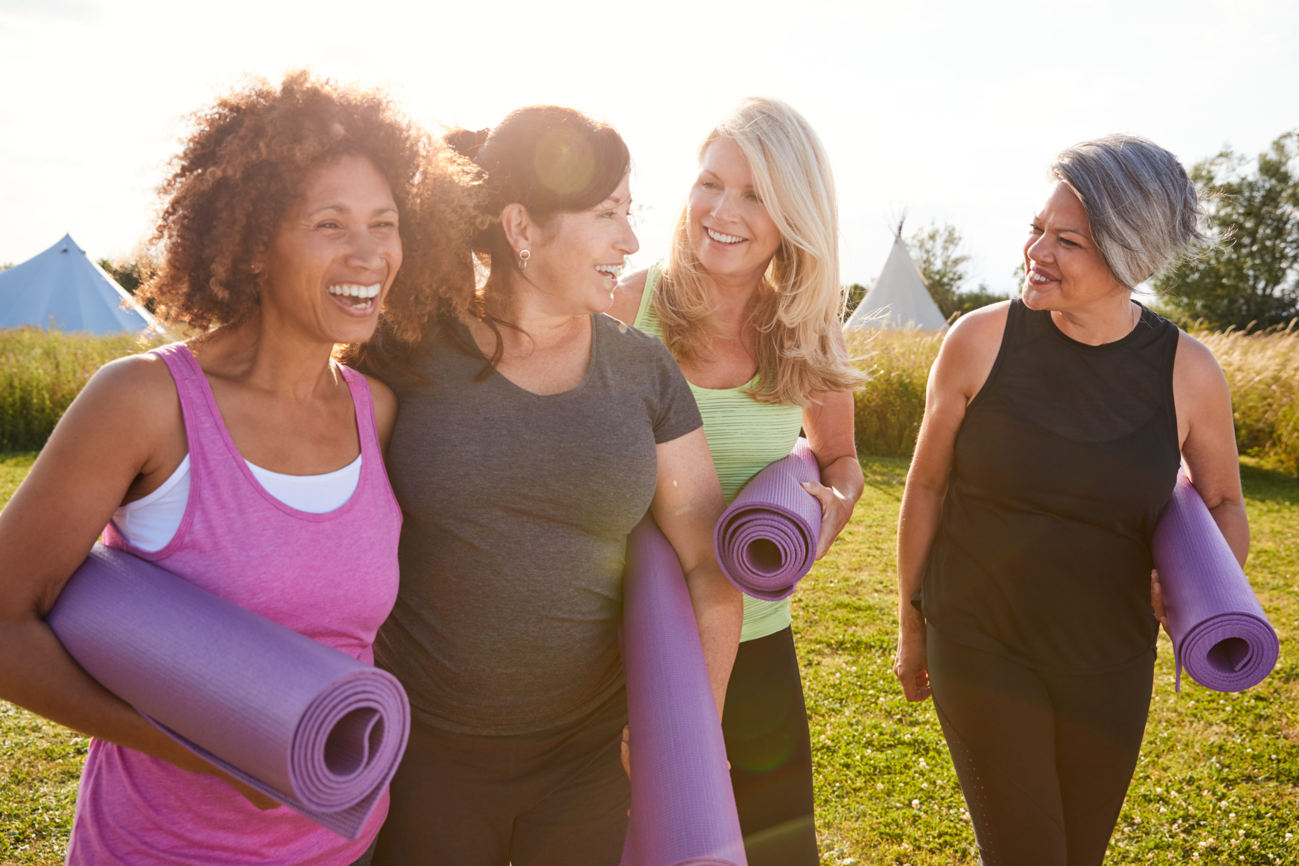 older female friends doing yoga